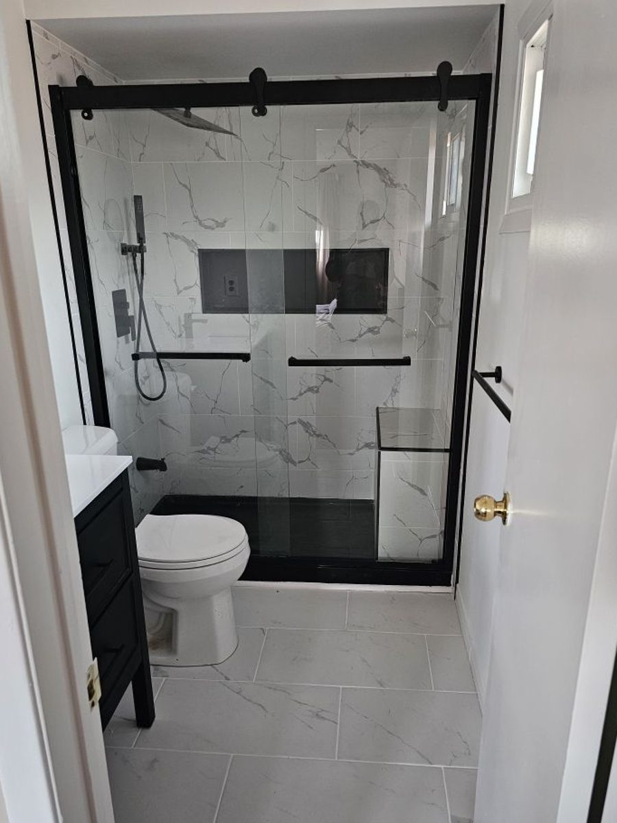 Finished marble bathroom by KDW Renovations